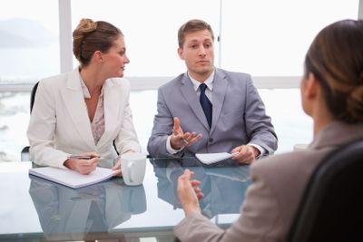 Business partners talking with lawyer