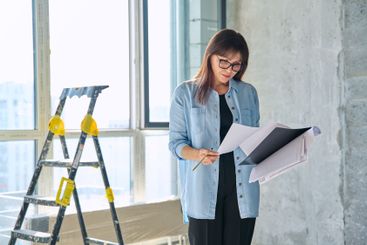 Female decorator of final finishing, repair manager in...