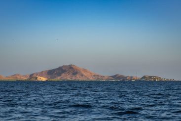 A Serene Coastal Landscape at Dusk Featuring a Beautiful...