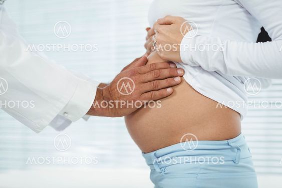 Doctor examining pregnant woman