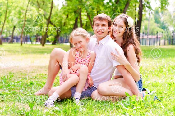 Family lying in the park