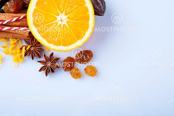 Sliced orange with cinnamon sticks and anise