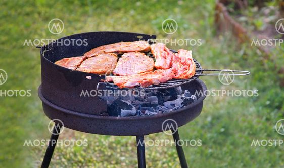 Summer grilling. Fresh meat on grill