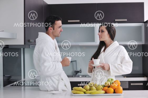 young couple have fun in modern kitchen