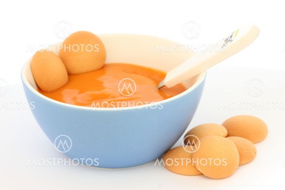 Red bowl with children fruit pap / mush with sponge-biscuits