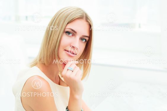 Portrait of a cute woman in a city cafe