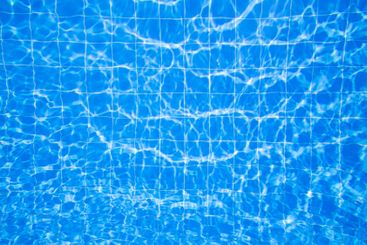 Clear water reflects sunlight creating beautiful...