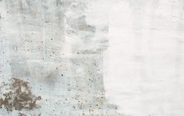 Old house wall with green grass as background