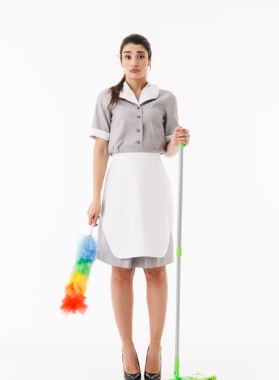 Full length photo of brunette maid 20s dressed in...