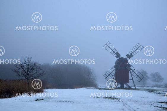 Foggy windmill silhouette