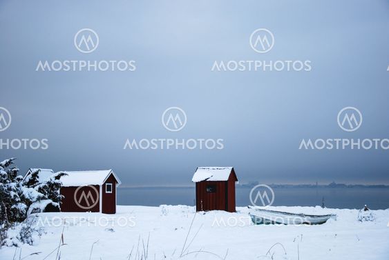 Winter view by old fishing cabins