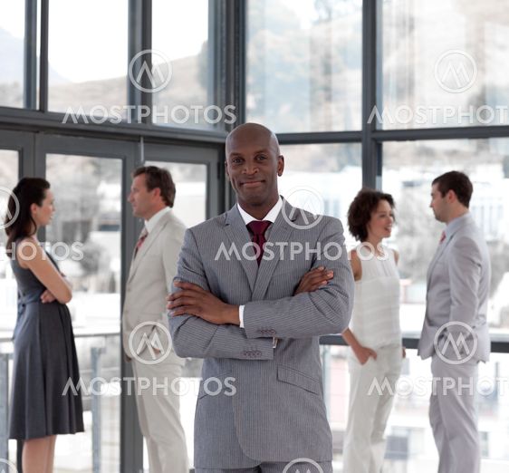 portrait of a echnic manager leading his team