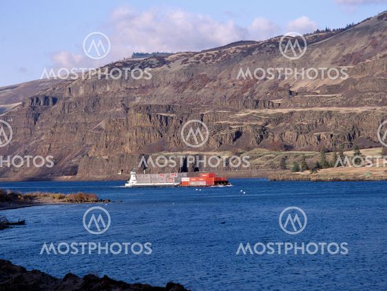 Red barge on the Columbia River, Oregon
