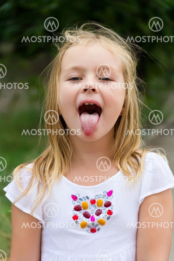 Cute girl with put out tongue