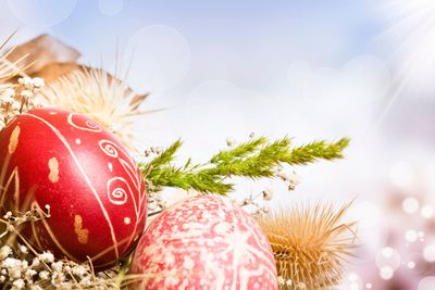 Red Easter eggs on colorful background