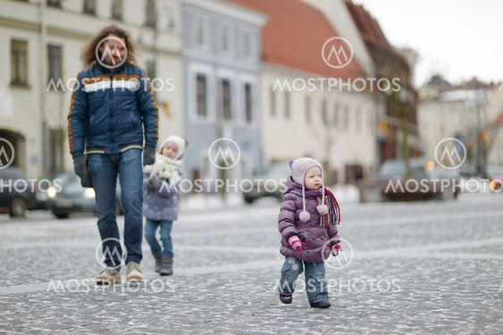 Young father and his girls on winter day