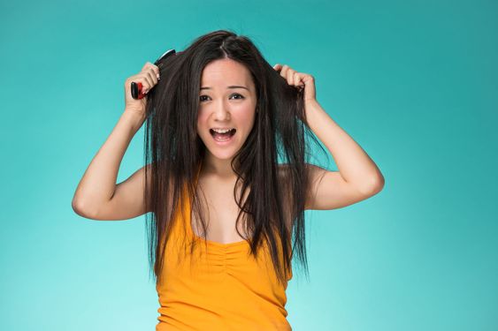 Frustrated young woman having a bad hair