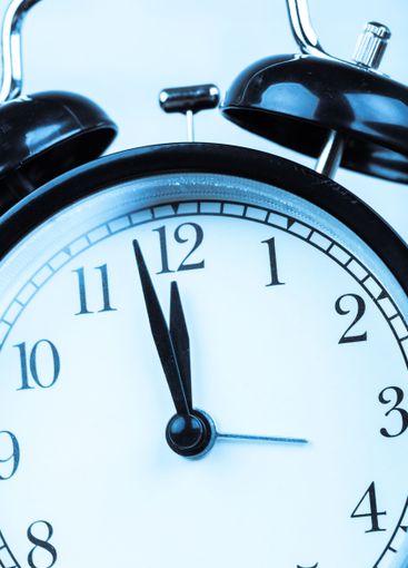 Close up of a black vintage alarm clock