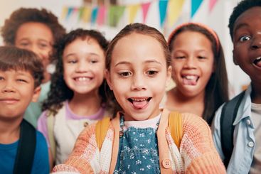 Selfie, happy and portrait of children in classroom for...