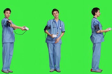 Medical assistant showing tonometer used to measure...