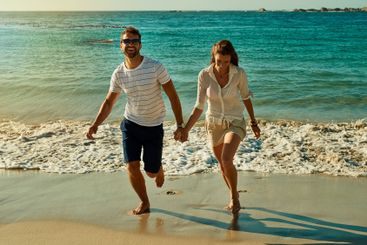 Beach, play and couple for joy, honeymoon and travel for...