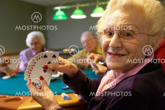 Senior adults playing bridge
