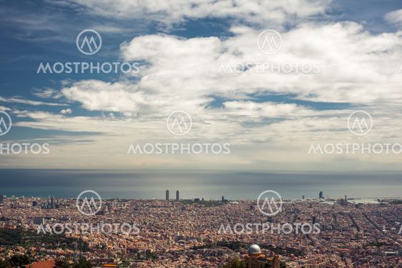 Barcelona city under cloudy sky overview