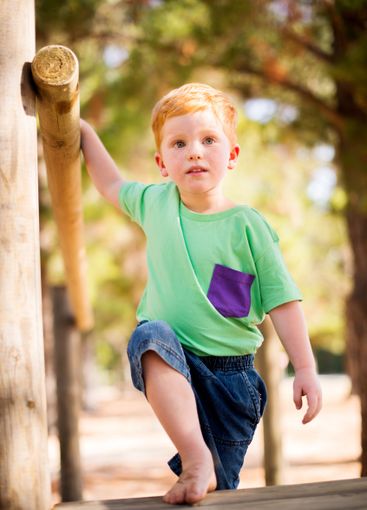 Boy, kid and walking with step in playground for fun...