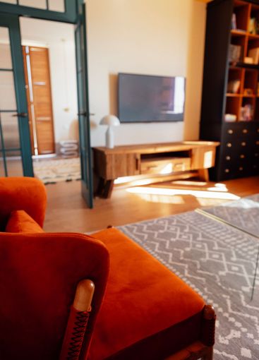 Close-up details of an elegant armchair made of orange...