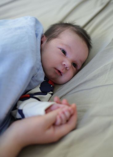 Cheerful newborn baby. Childhood, new family and baby...