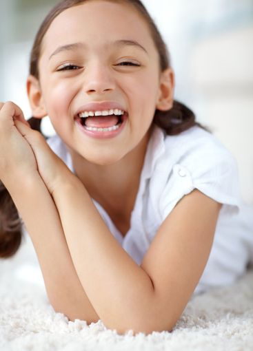 Carpet, laughing or portrait of girl in house for joy,...