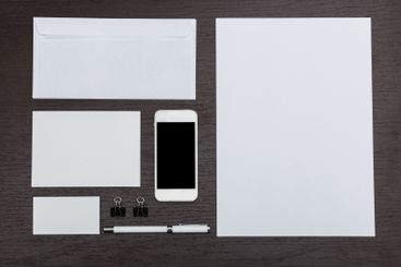 Collection of stationery items arranged on a wooden...