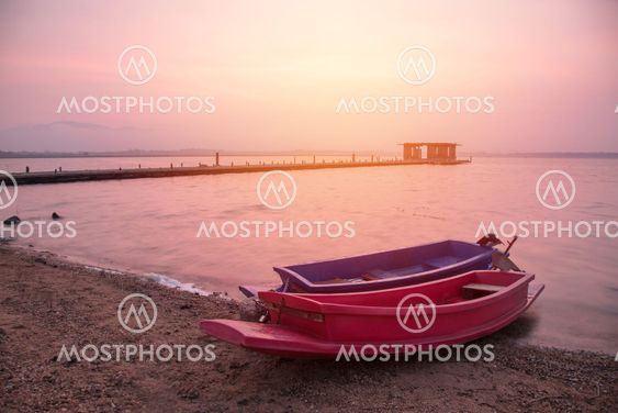 two boat in lake at the sunrise