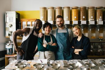 Portrait of smiling male and female multiracial...
