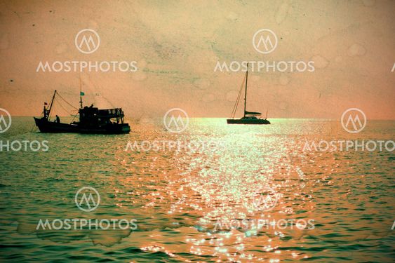 Fisherman boat at sunset