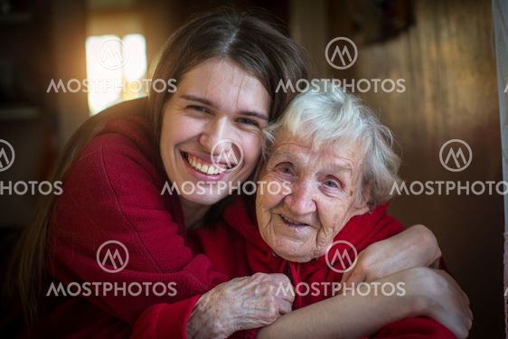 Portrait of Girl hugging her grandmother.