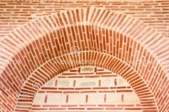 Texture of a wall with red bricks