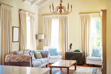 Empty living room, home and interior with sofa, table or...