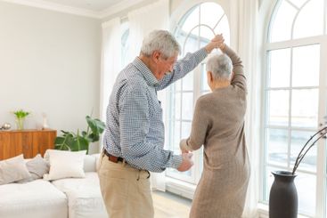 Keep moving. Romantic senior mature couple dancing to...