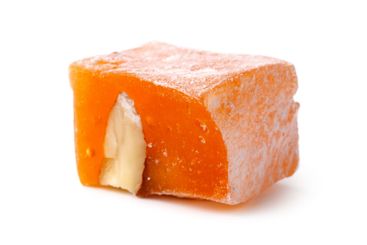 Traditional Turkish delight filled with nuts, showcasing...