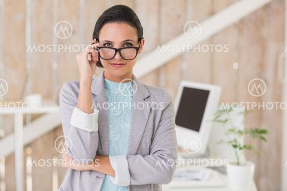 Stylish brunette working from home