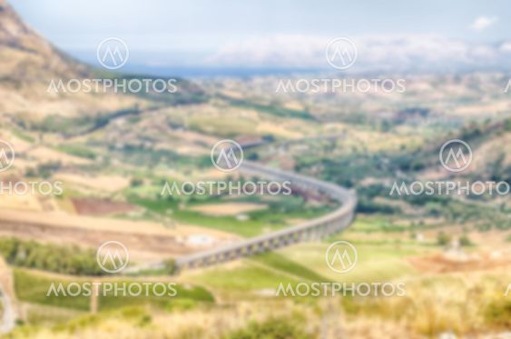 Defocused background with a S-Curve Highway Overpass in...