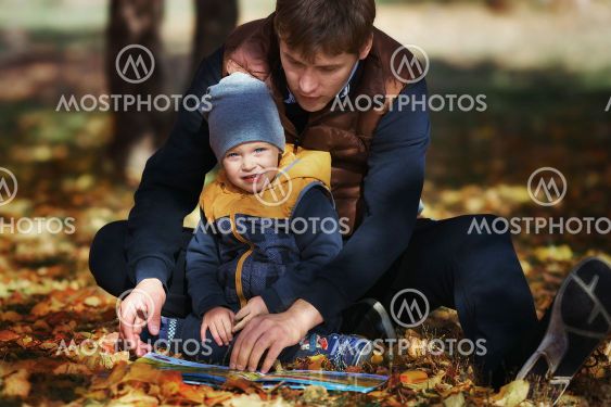 Father's Day. A young father and son in the park on the...