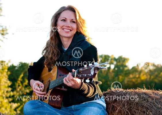 Playing guitar in the field