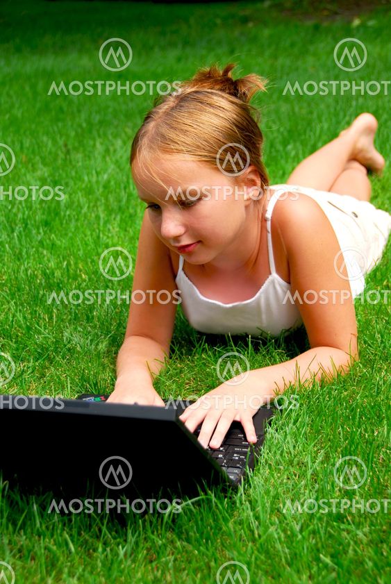 Girl computer grass