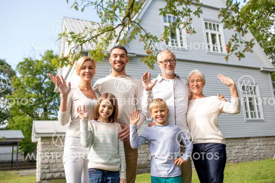 happy family in front of house outdoors