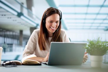 The Young Female Business Coach Leading Virtual Language...