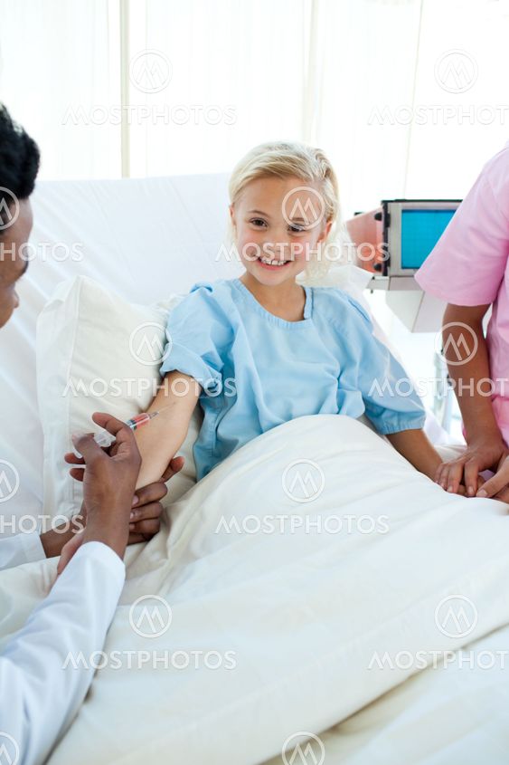 Smiling child patient getting a vaccinate