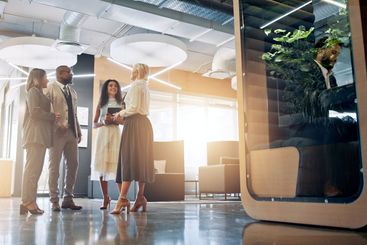 Lobby, pod and business people in office for coworking...