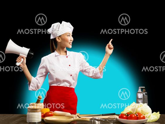 Asian female chef holding a megaphone